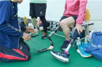 individuals trying out their prosthetic legs