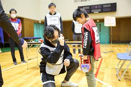 Picture of kid having his fitness checked